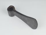a close up of a metal spoon on a white surface