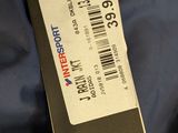 a close up of a blue jacket with a tag on it