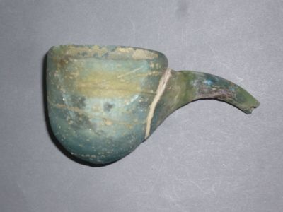 a green pipe sitting on top of a table