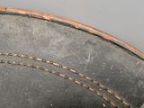 a close up of a hat with a clock on the side of it