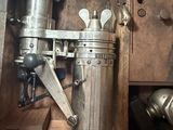 a metal object that is sitting in a wooden box