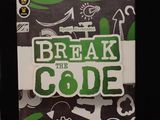 a box of break the code on a table next to a cup of coffee