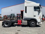 a picture of a white truck parked in front of a building