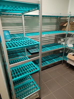 a room with shelves and shelves filled with boxes
