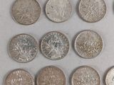 a lot of coins that are sitting on a table