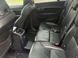 the interior of a car with black leather seats and a center console