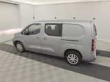 a picture of a silver van parked in a garage