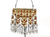 an image of a gold purse with red stones hanging from it ' s handle