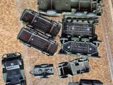 many different types of toy trains on display in a case