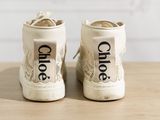 a close up of a pair of shoes with the word chloe written on them
