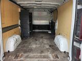 an image of a van with a lot of trash in the back