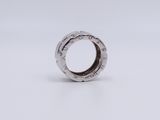 an image of a silver ring on a white surface
