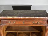 a wooden cabinet with a marble top and two drawers