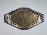 a silver tray with a mirror on it on a table