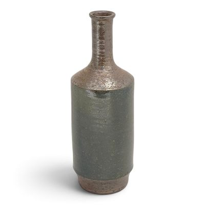 a vase that is sitting on a white surface