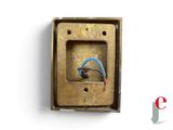 a small metal box with a blue wire in it