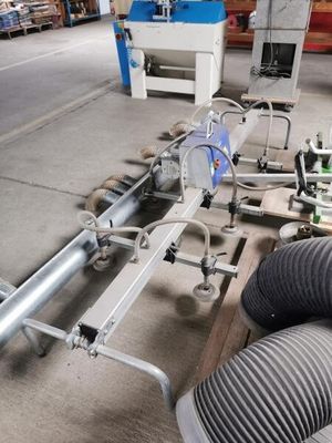 a machine that is working on pipes in a factory