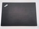 a black mouse pad on a white table