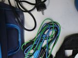 a blue bag that is sitting on a table next to other items