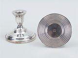 pair of silver plated candlesticks and a silver plated candle holder