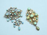 two pairs of turquoise and gold brooches on a blue background