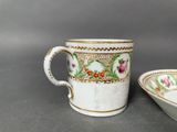 pair of antique porcelain coffee cups and saucer