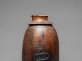 an image of a wooden vase with a tree on it