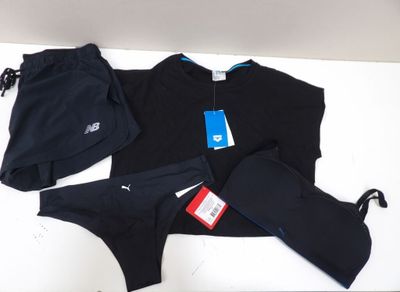 black underwear and a hat are laying on a white surface