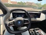 a steering wheel and dashboard of a bmw car