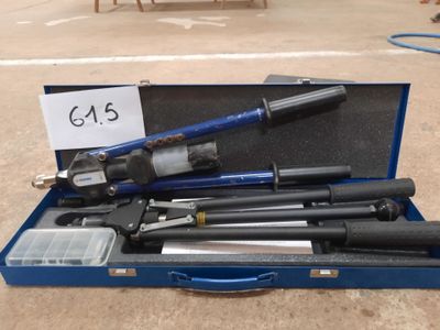 a blue case with tools in it sitting on the floor