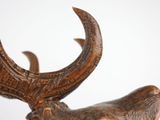 a close up of a statue of a deer with horns