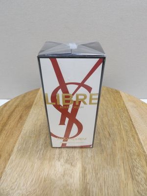 the box is sitting on a wooden table with a white wall in the background