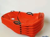 four orange plastic tubs stacked on top of each other