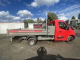 an image of a red truck parked in a lot