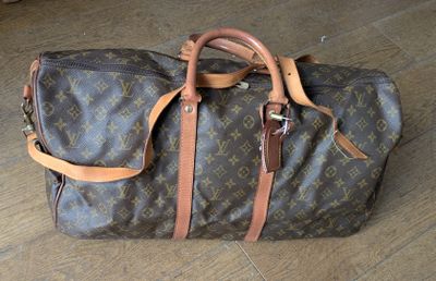 a brown and tan bag sitting on a wooden floor