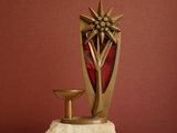 a sculpture of a star on a pedestal on a table