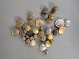 a lot of buttons that are on a table