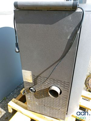 a small refrigerator that is sitting on a pallet