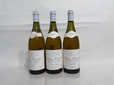 three bottles of wine sitting on top of a table next to each other