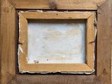 an old picture frame with a white background and a brown wood frame