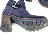pair of blue sued boots with buckles and wooden soles