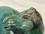 a statue of a horse that is sitting on a table