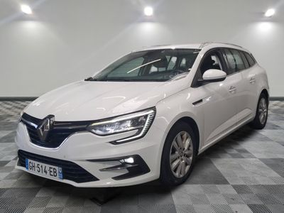 the white car is parked on a checkered floor in a room