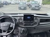 a view of the inside of a car from the driver ' s seat