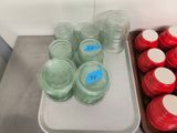 a tray of jars and a tray of jars on a table