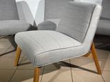 two chairs and a ottoman in a room with tile flooring