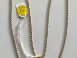 a yellow tag on a white string with a yellow tag attached to it
