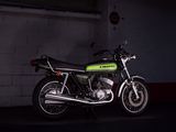 a motorcycle parked in a parking garage at night