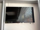 a flat screen tv mounted on a wall in a room