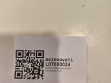 a small piece of paper with a qr code on it